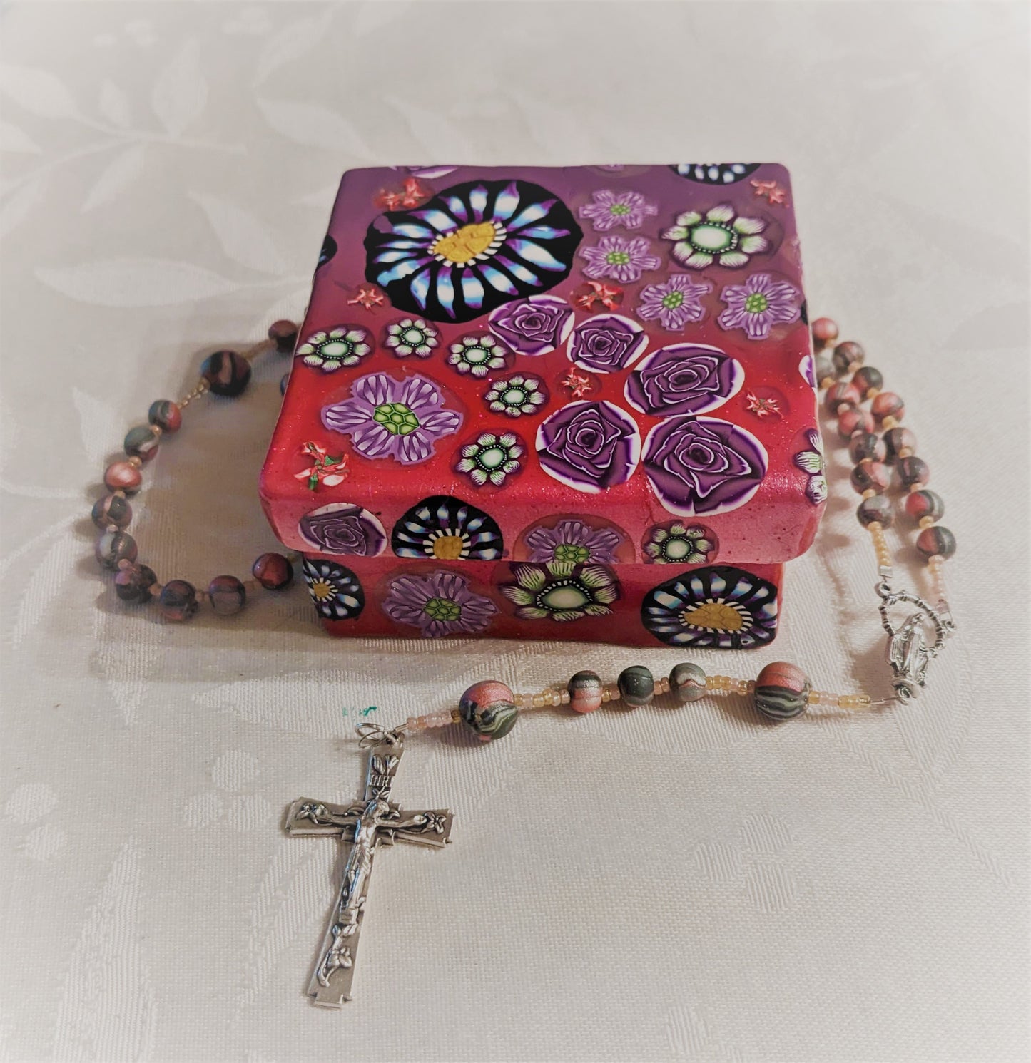 Close up of polymer clay box and rosary